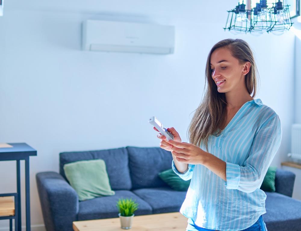 woman with air source heat pump